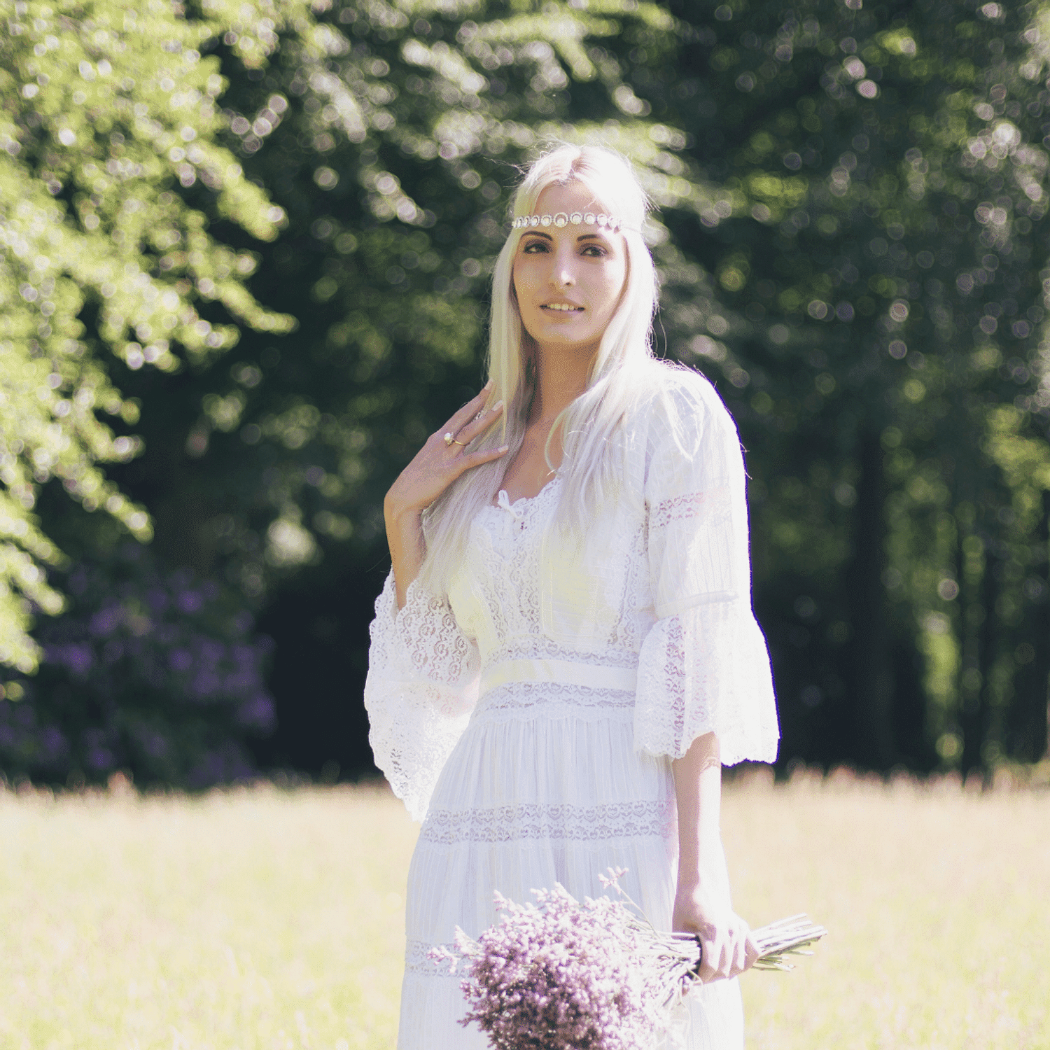 Portrait of Ariane, a professional stylist at Ivy & Vine Beauty Haven, showcasing their expertise and style.