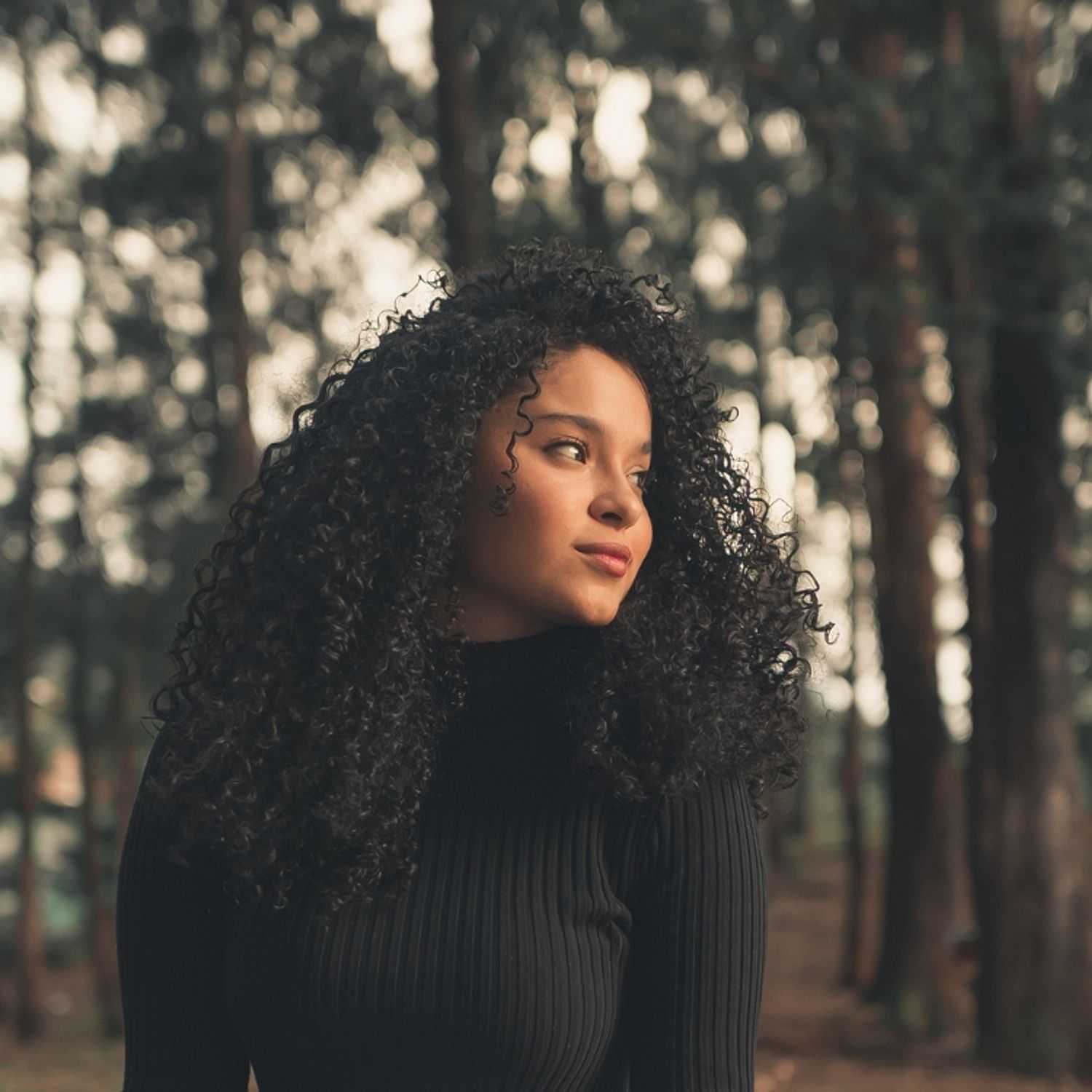 Portrait of Eliana, a professional stylist at Ivy & Vine Beauty Haven, showcasing their expertise and style.